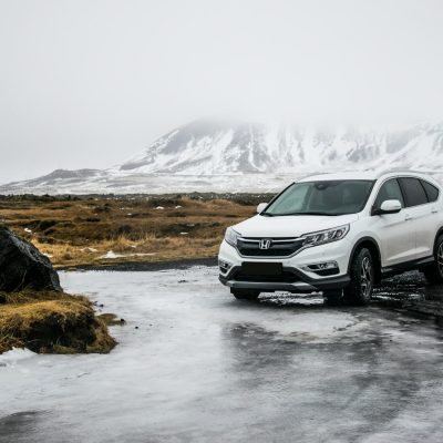 white Honda SUV on gray floor